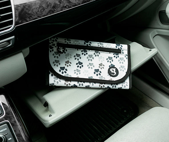 Paws printed fabric organizer inside car glove compartment featuring zipper and logo geckobrands