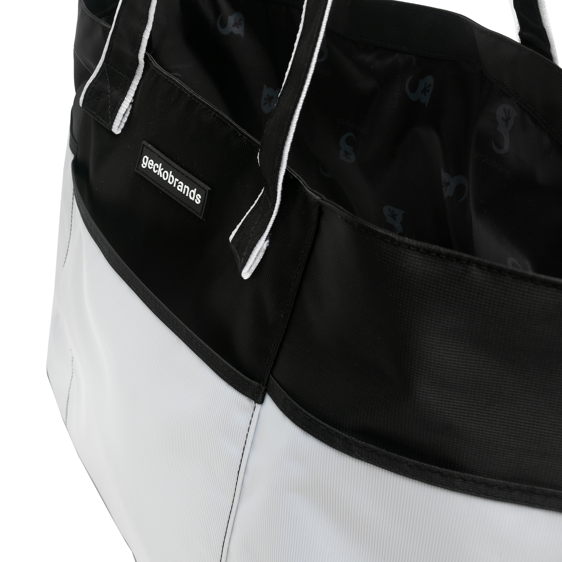 Close-up of a black and white bag with 'geckobrands' logo.