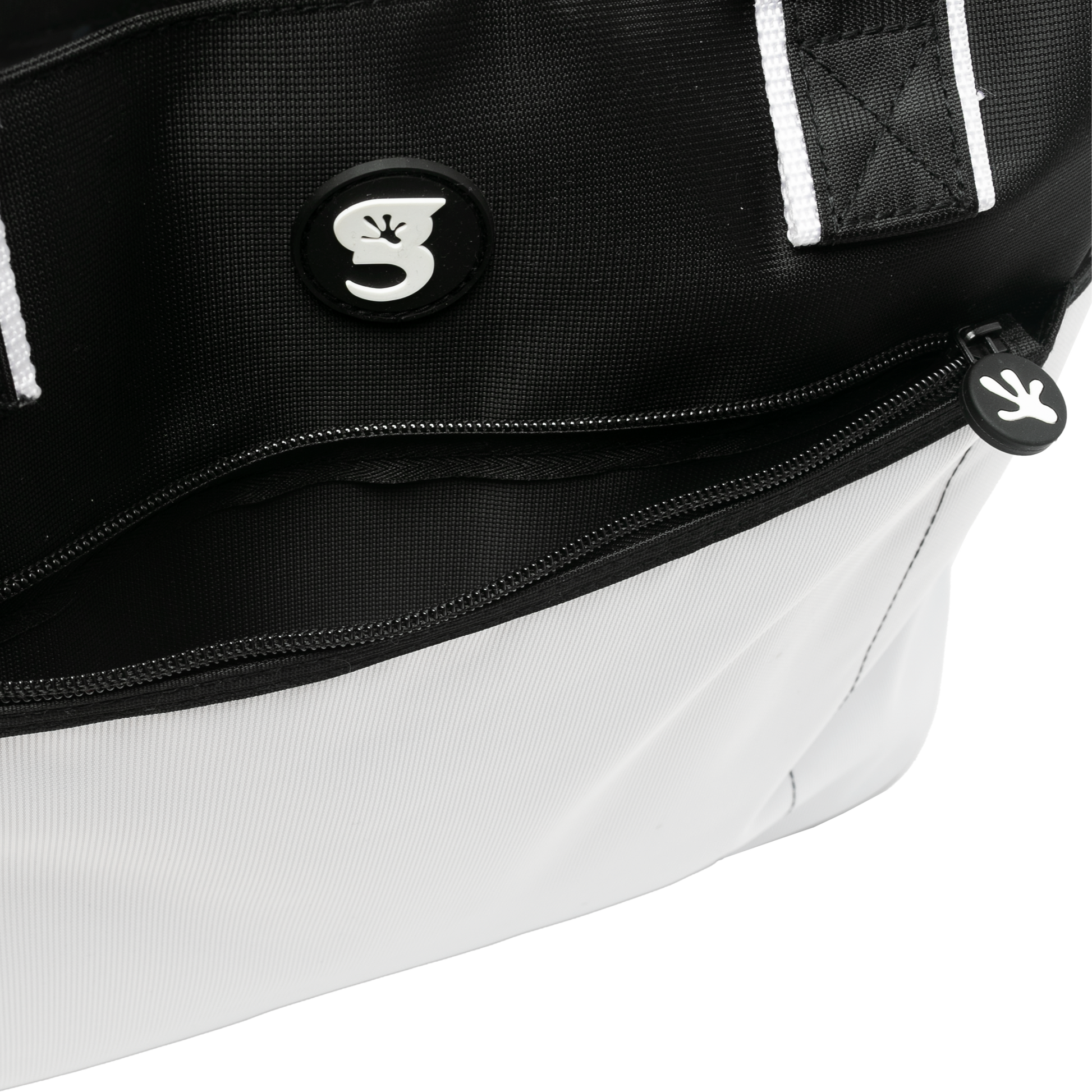 Close-up of a black and white bag with a brand logo on a white background